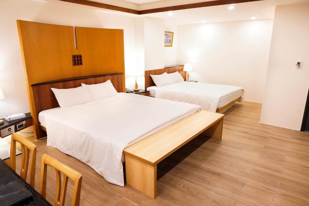 Postel nebo postele na pokoji v ubytování Kao Yuan Hotel - Zhong Zheng