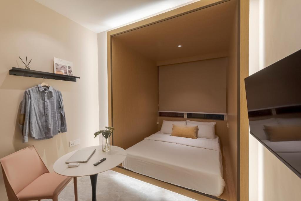 Postel nebo postele na pokoji v ubytování Harper Boutique Hotel at Sutera Avenue