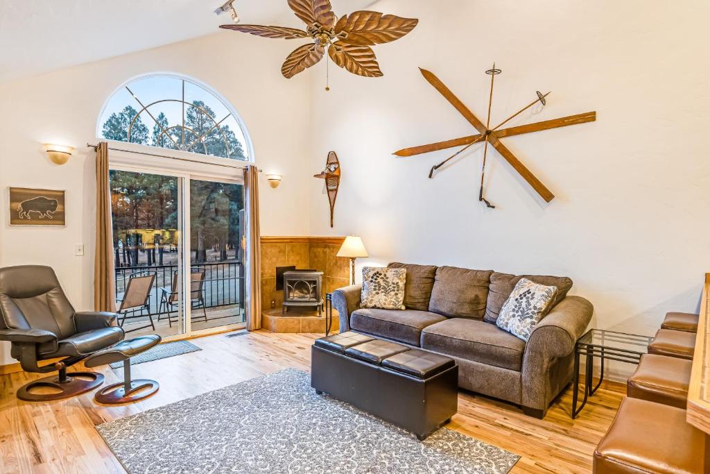 a living room with a couch and a chair at The Lakeview Escape in Pagosa Springs