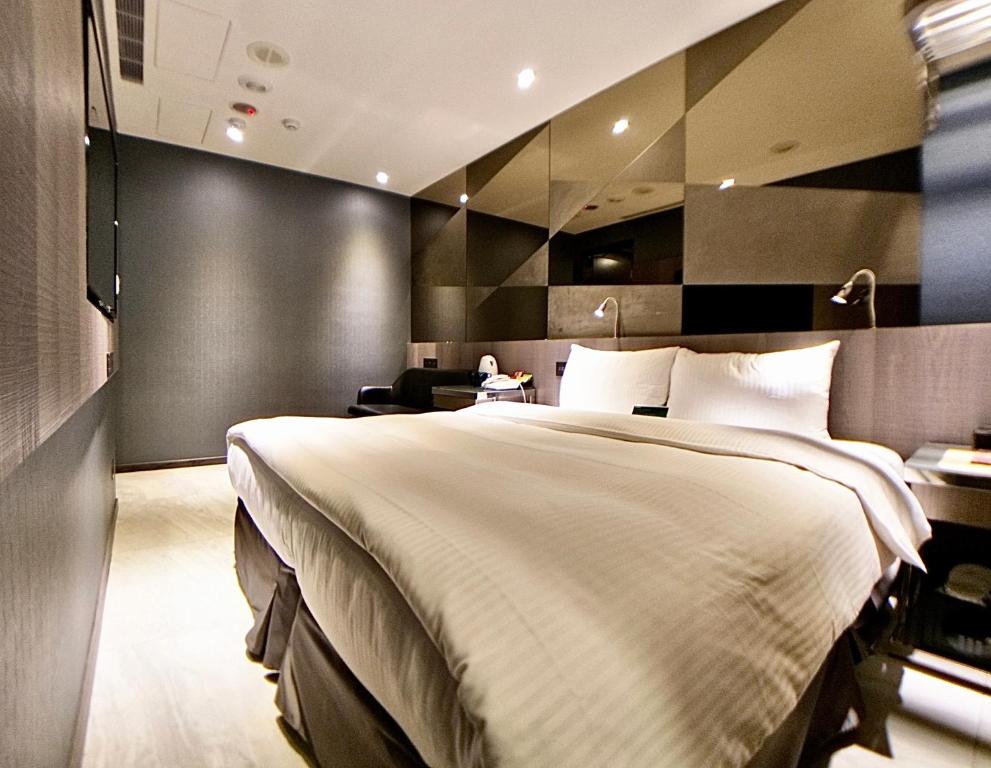Postel nebo postele na pokoji v ubytování Beauty Hotels Taipei - B7 Journey