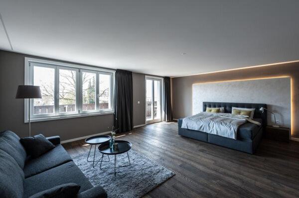 a living room with a bed and a couch at wolke 4 in Büren an der Aare