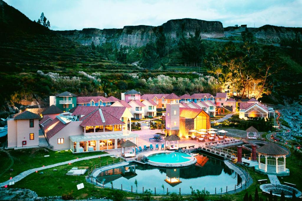 an aerial view of a resort with a pool at Aranwa Pueblito Encantado del Colca in Coporaque