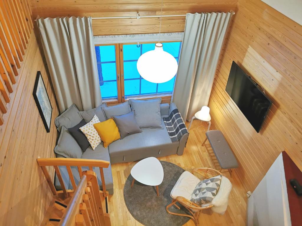 an overhead view of a living room with a couch at Gold Legend Paukkula #1 - Saariselkä Apartments in Saariselka