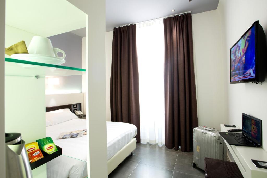 TV a/nebo společenská místnost v ubytování Crosti Hotel