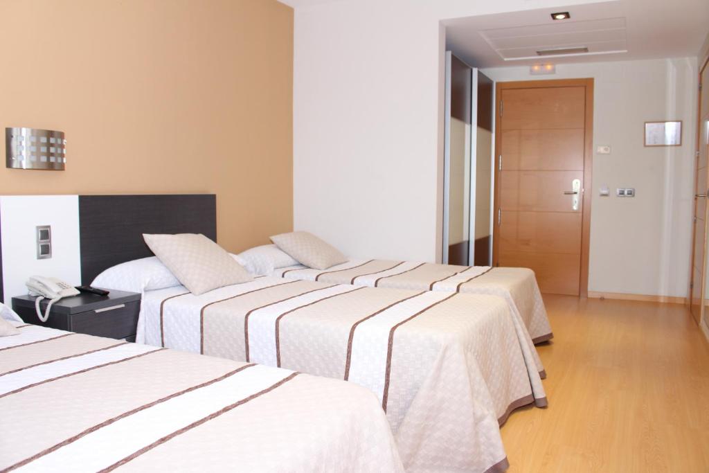Posteľ alebo postele v izbe v ubytovaní Hotel Ciutat d'Amposta