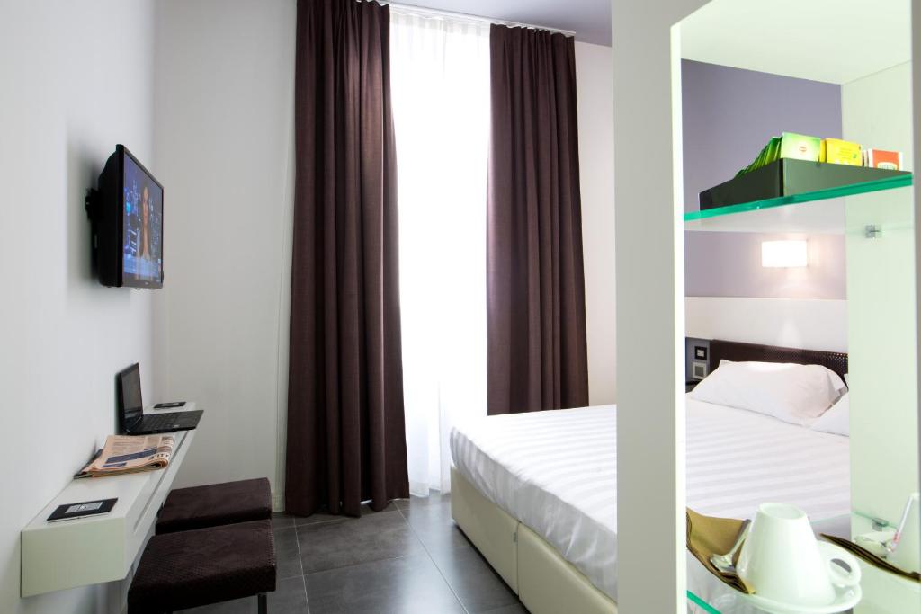 TV a/nebo společenská místnost v ubytování Crosti Hotel