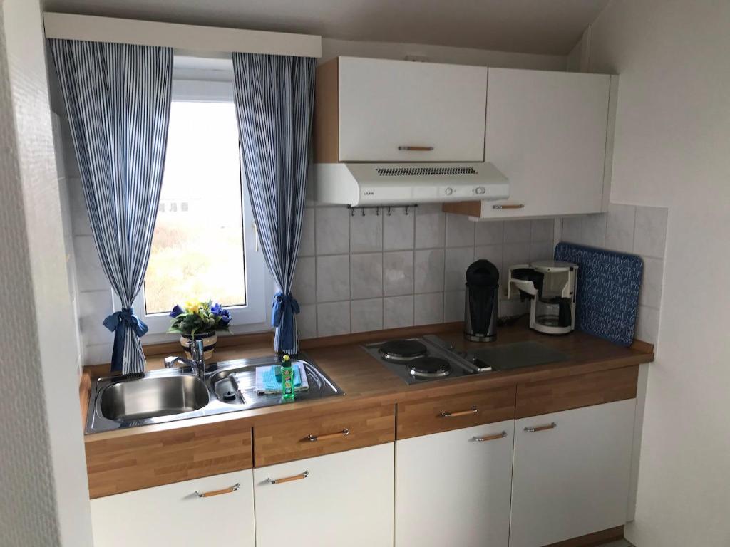 Kuchyň nebo kuchyňský kout v ubytování Gästehaus am Deich