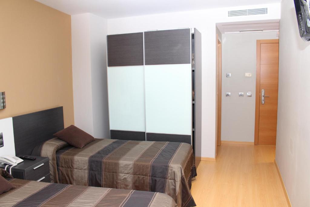 Posteľ alebo postele v izbe v ubytovaní Hotel Ciutat d'Amposta