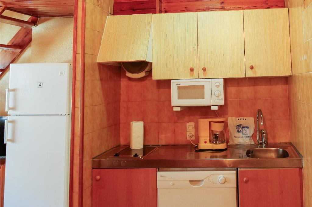 Kuchyň nebo kuchyňský kout v ubytování Kione Lake Placid