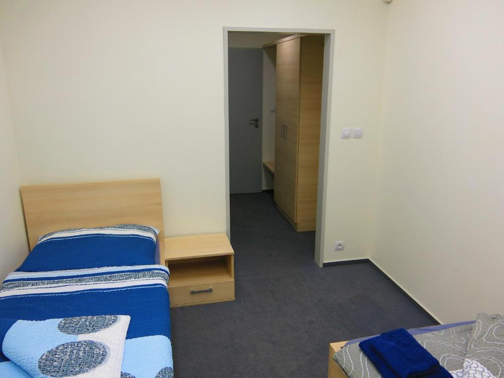 a small room with two beds and a hallway at Elmontex Air in Mošnov