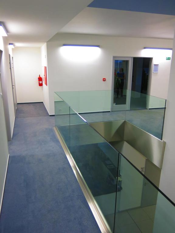 a hallway with a glass counter in a building at Elmontex Air in Mošnov