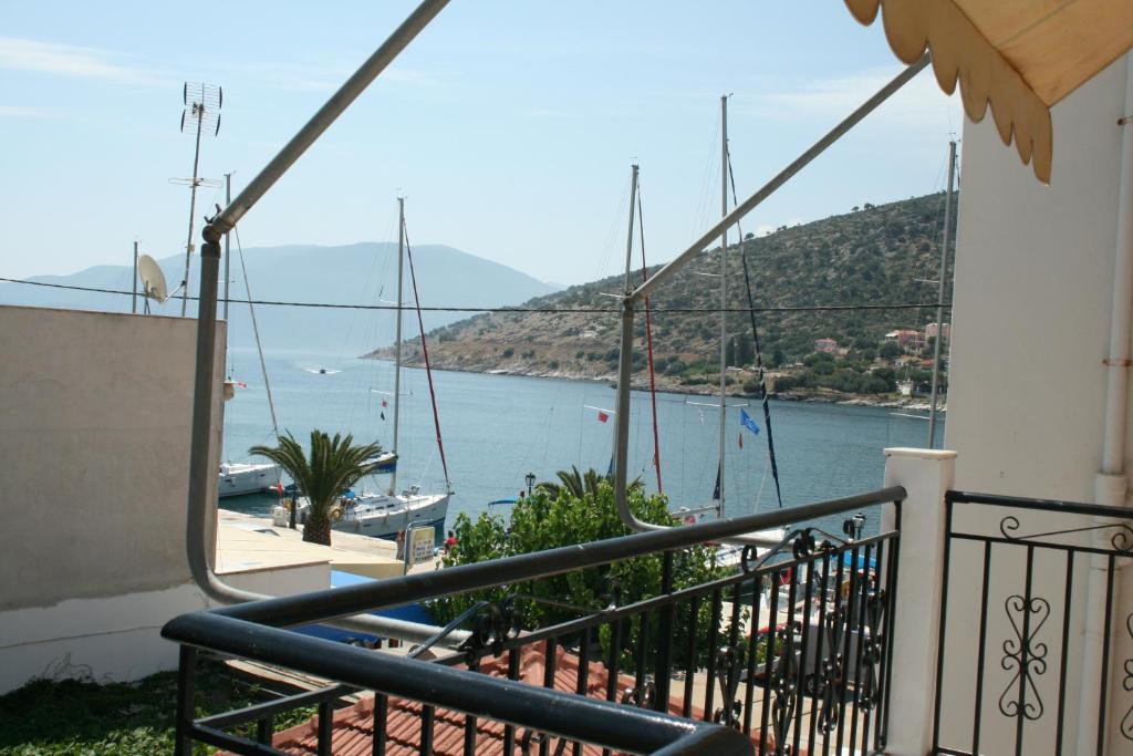 a balcony with a view of a body of water at Pelagias Apartments in Agia Effimia