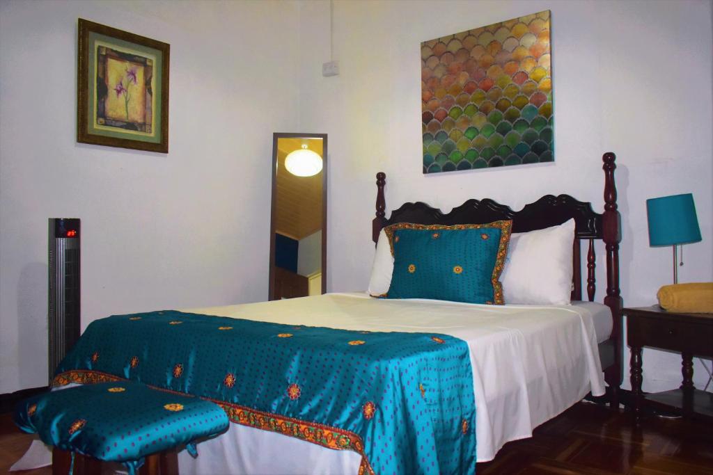 Postel nebo postele na pokoji v ubytování Lajuela BnB & Hostel