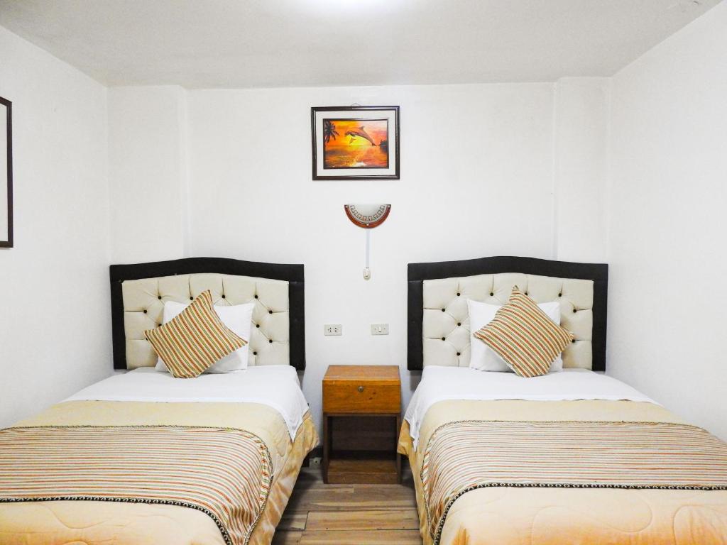 Postel nebo postele na pokoji v ubytování Hostal Encanto Machupicchu