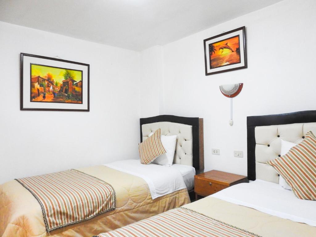 Postel nebo postele na pokoji v ubytování Hostal Encanto Machupicchu