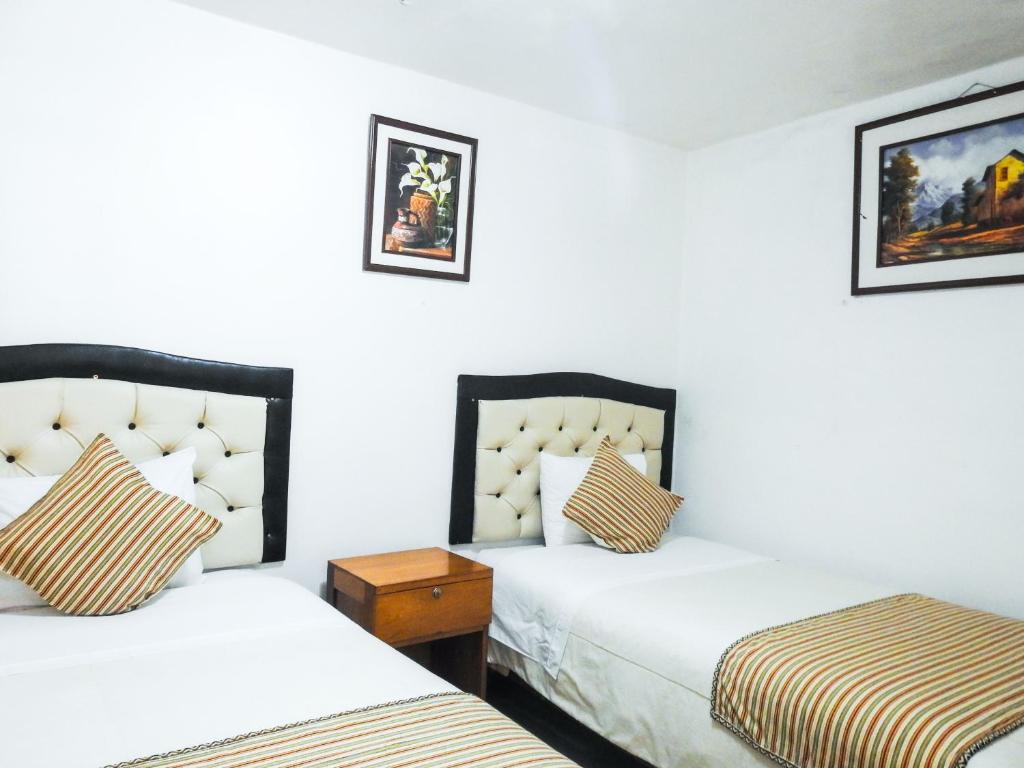 Postel nebo postele na pokoji v ubytování Hostal Encanto Machupicchu