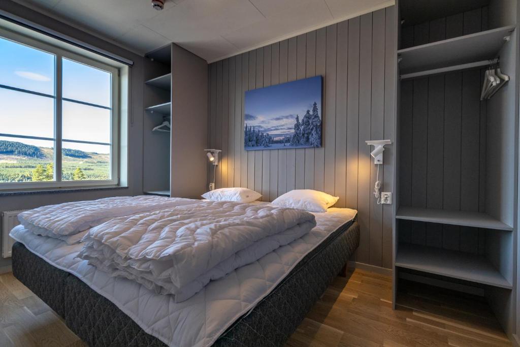 Кровать или кровати в номере Hotell Kurbits
