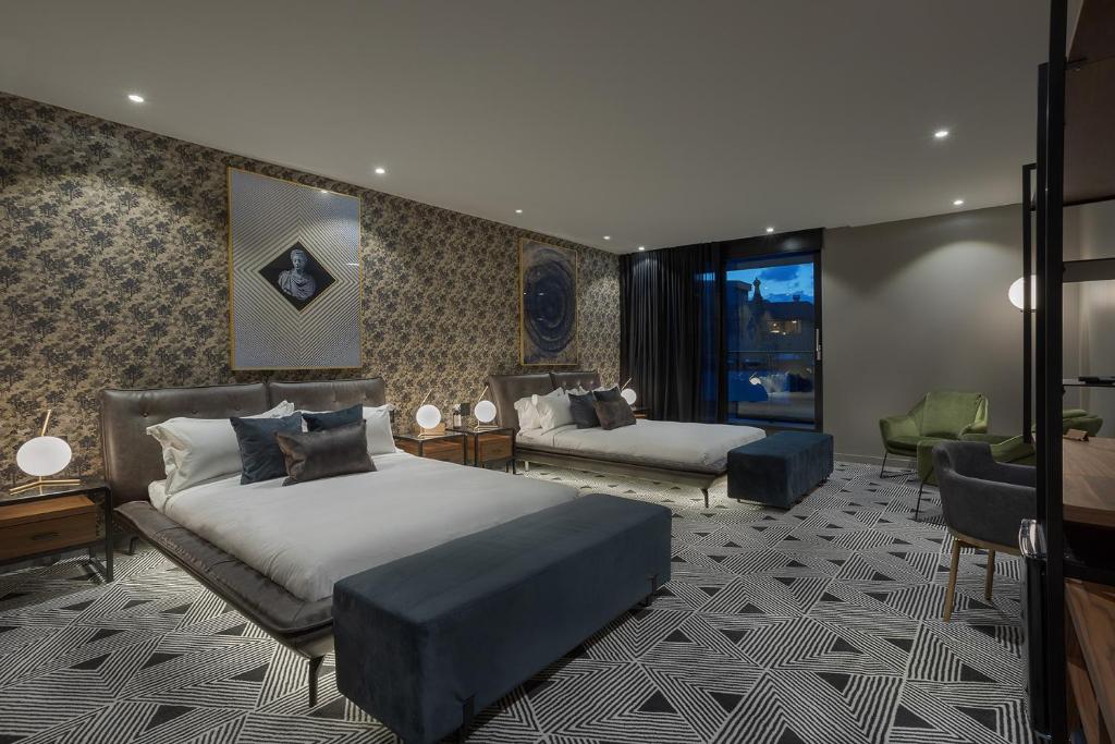 Postel nebo postele na pokoji v ubytování Hotel St.Thomas