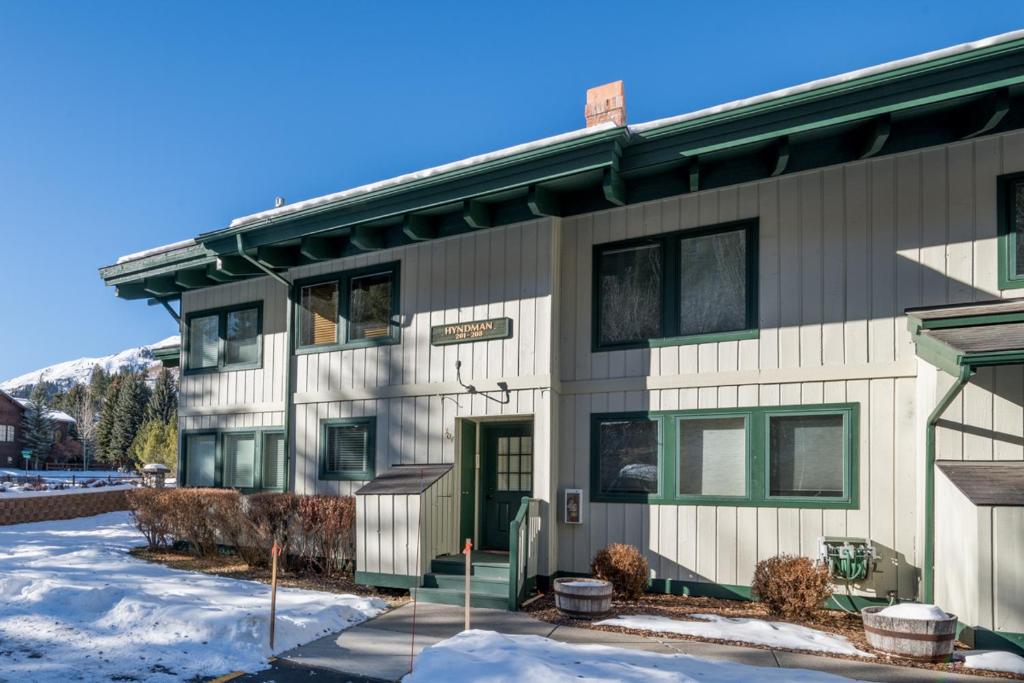 a building with snow in front of it at Prospector 204 in Ketchum