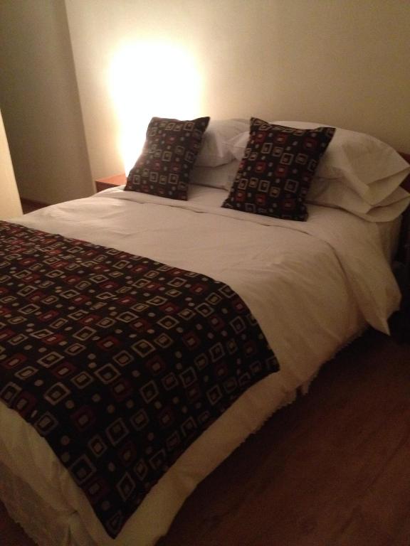 Postel nebo postele na pokoji v ubytování Hostal del Valle