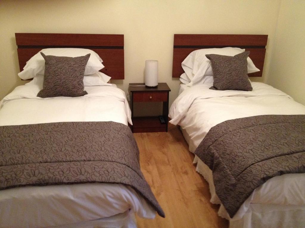 Postel nebo postele na pokoji v ubytování Hostal del Valle