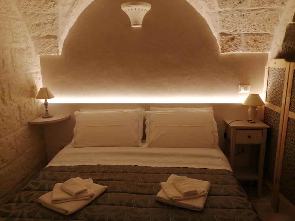Postel nebo postele na pokoji v ubytování Al Caveau - Holiday House