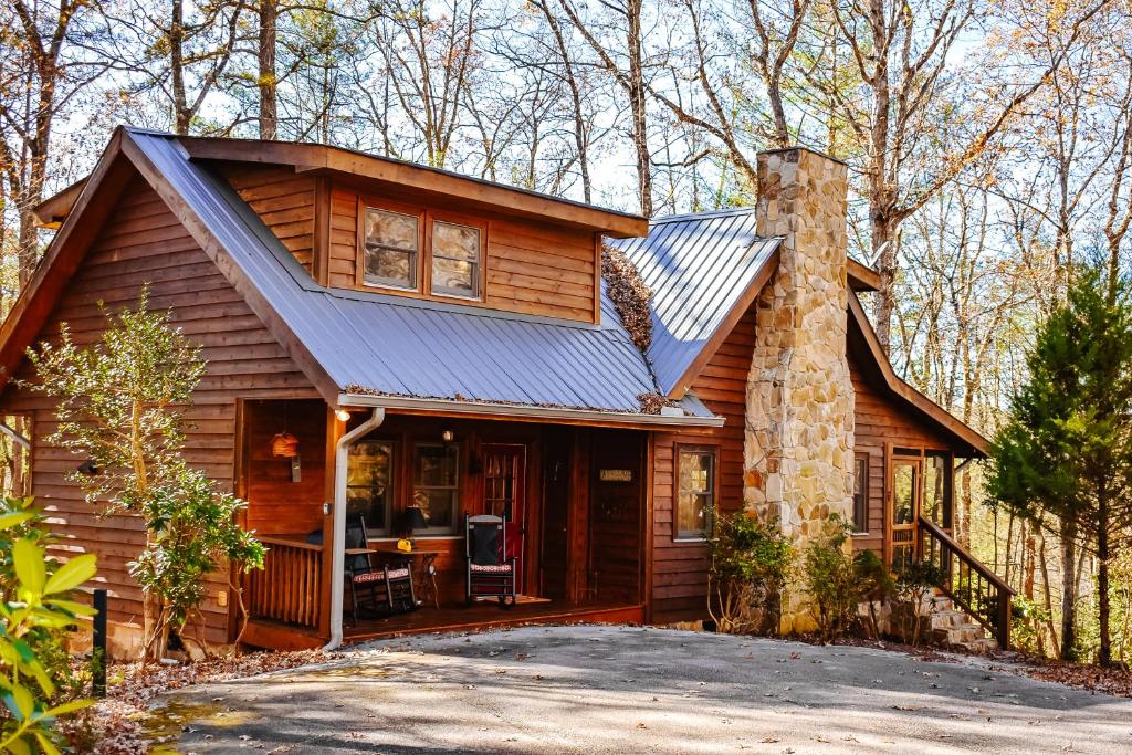 a log cabin with a gambrel roof at Tranquility Place in Lakemont