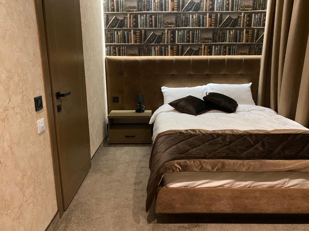 Postel nebo postele na pokoji v ubytování Kuprin Hotel