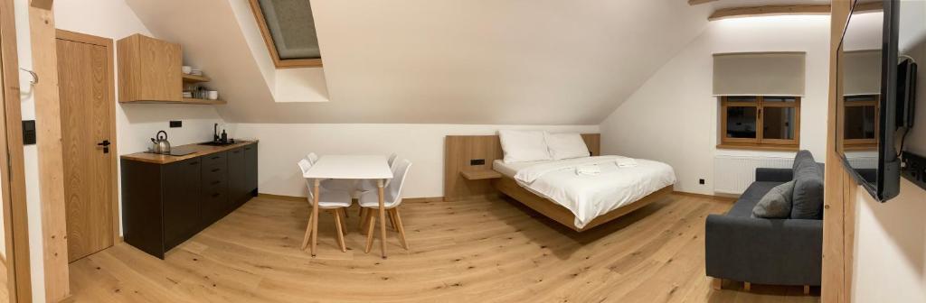 Postel nebo postele na pokoji v ubytování Apartmány Hacienda Boží Dar