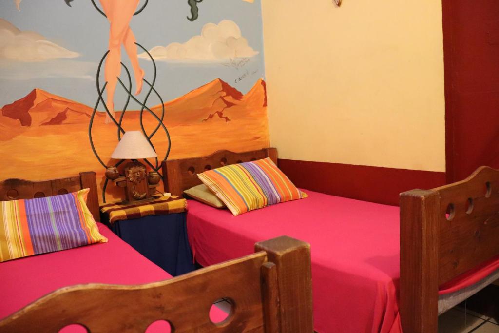 Postel nebo postele na pokoji v ubytování Hostel Casa Zalaoui