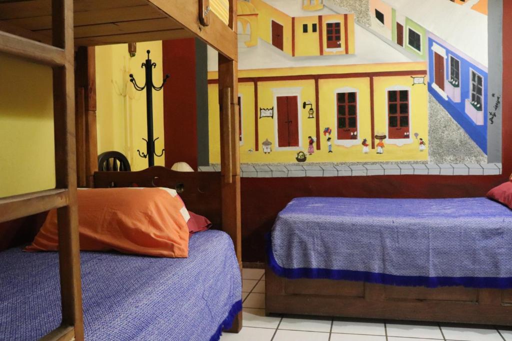 Postel nebo postele na pokoji v ubytování Hostel Casa Zalaoui