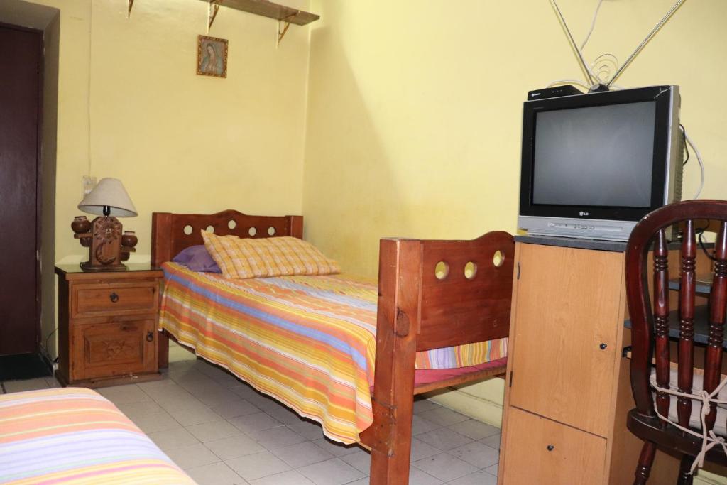 Postel nebo postele na pokoji v ubytování Hostel Casa Zalaoui