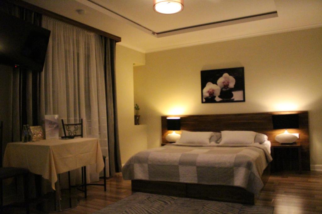 Posteľ alebo postele v izbe v ubytovaní PIANO CAFE b&b