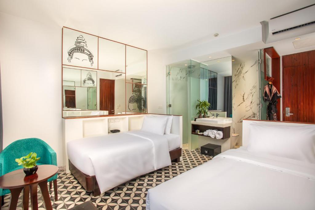 Postel nebo postele na pokoji v ubytování UTEY Hotel