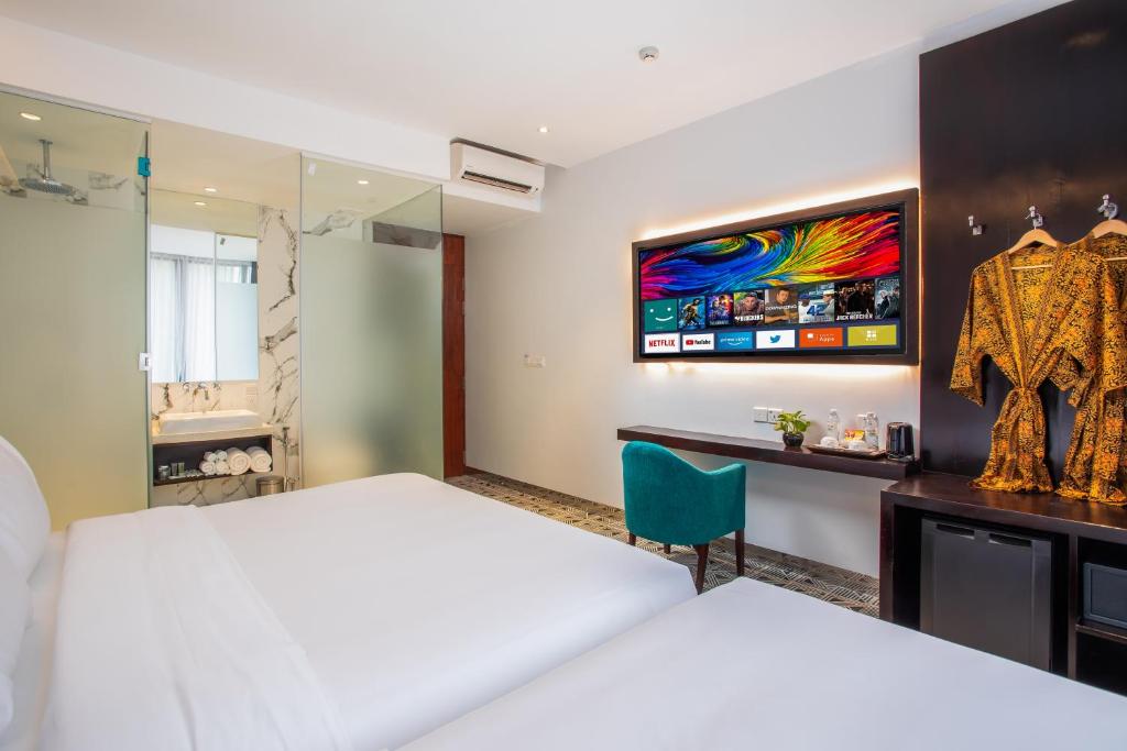Postel nebo postele na pokoji v ubytování UTEY Hotel