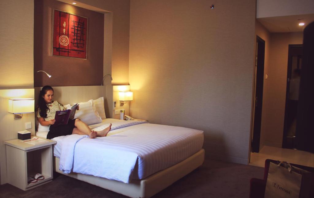 Postel nebo postele na pokoji v ubytování Biz Hotel Batam