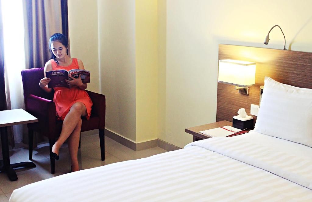 Postel nebo postele na pokoji v ubytování Biz Hotel Batam