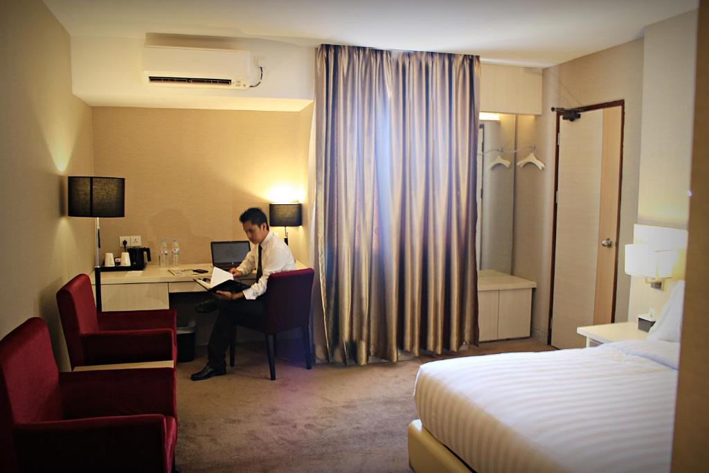 Postel nebo postele na pokoji v ubytování Biz Hotel Batam