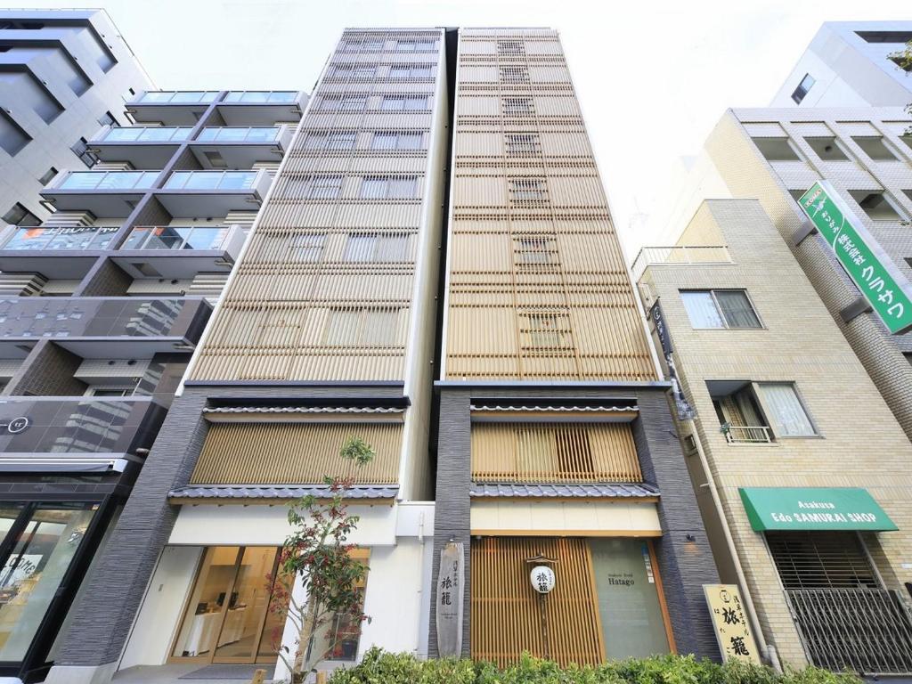 an apartment building in the city of hong kong at Asakusa Hotel Hatago in Tokyo