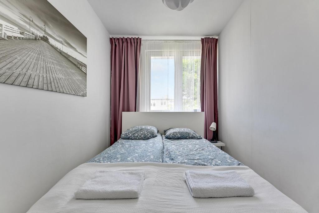Posteľ alebo postele v izbe v ubytovaní Apartament Nadmorski