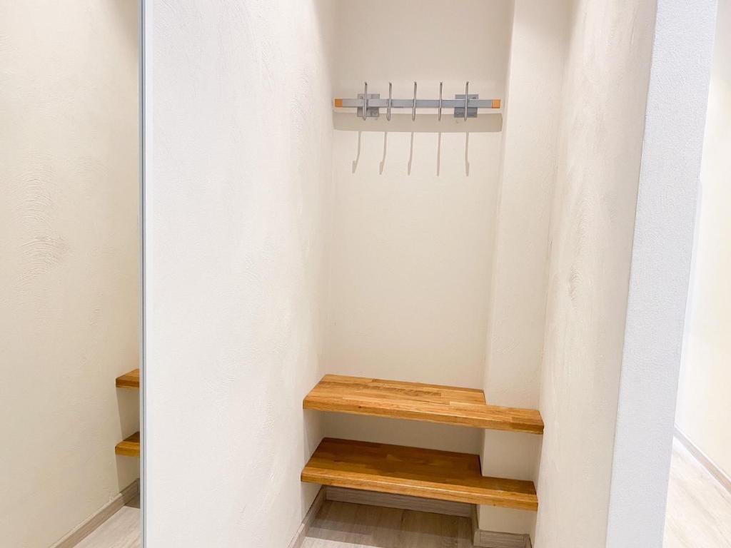 a staircase with a wooden bench in a room at Vakantiehuis in het Centrum van Domburg DO19 in Domburg