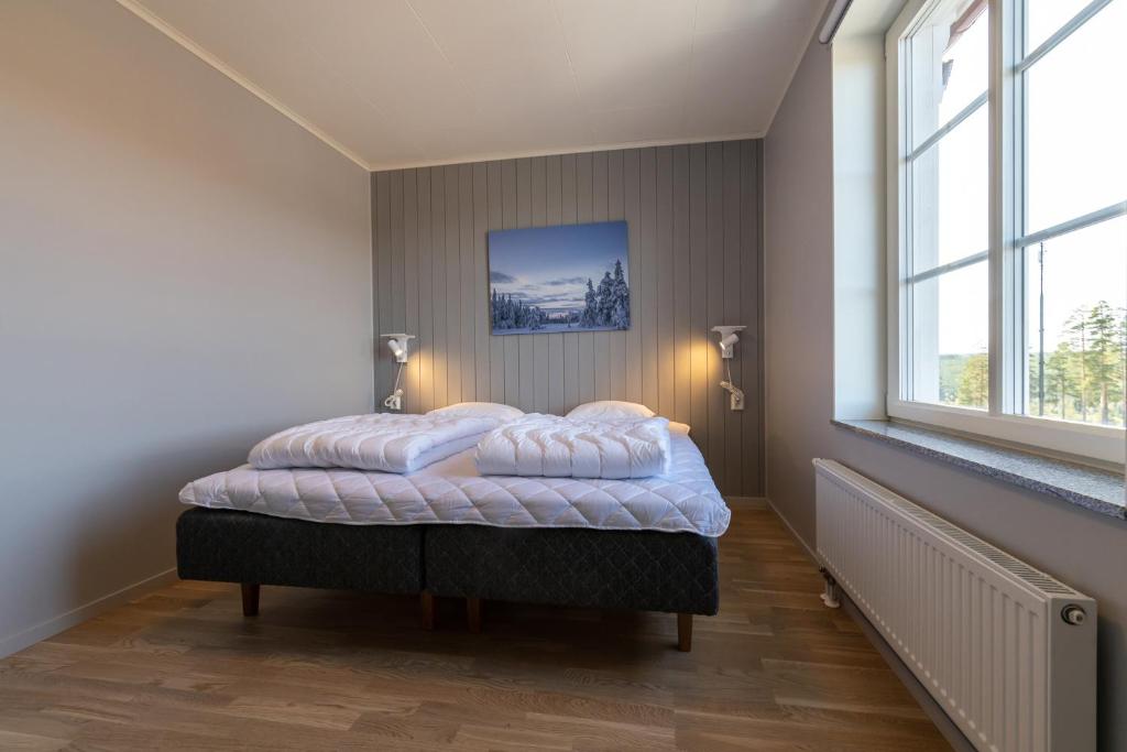 Кровать или кровати в номере Hotell Kurbits