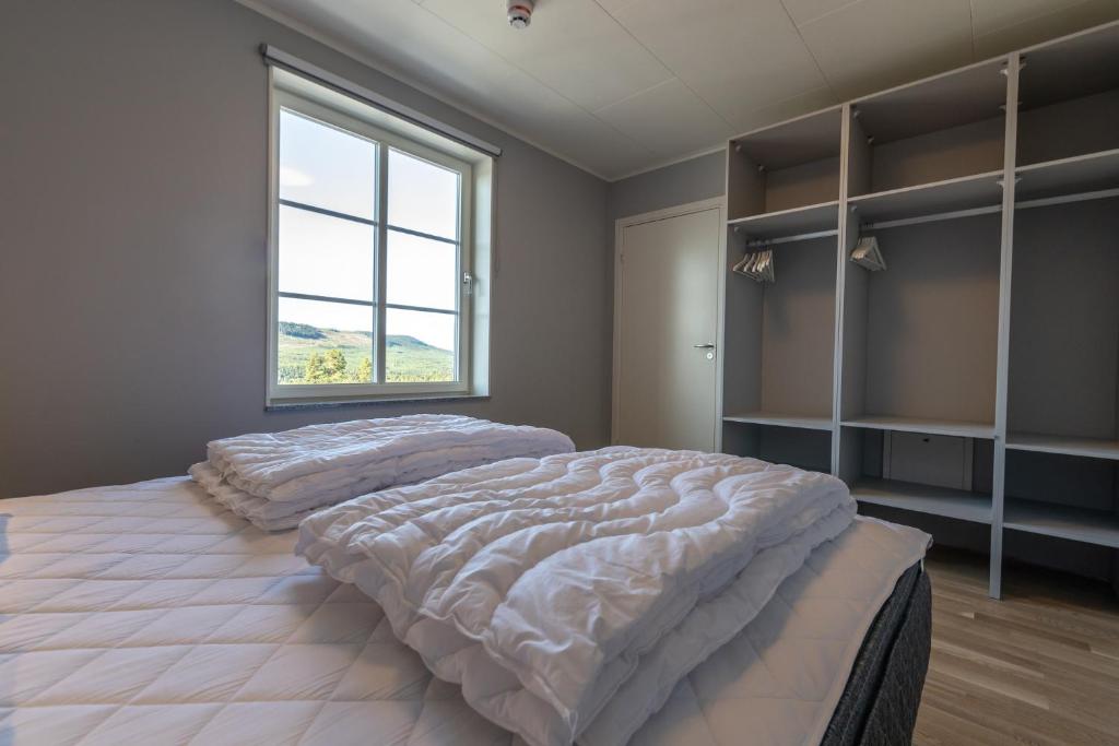 Кровать или кровати в номере Hotell Kurbits