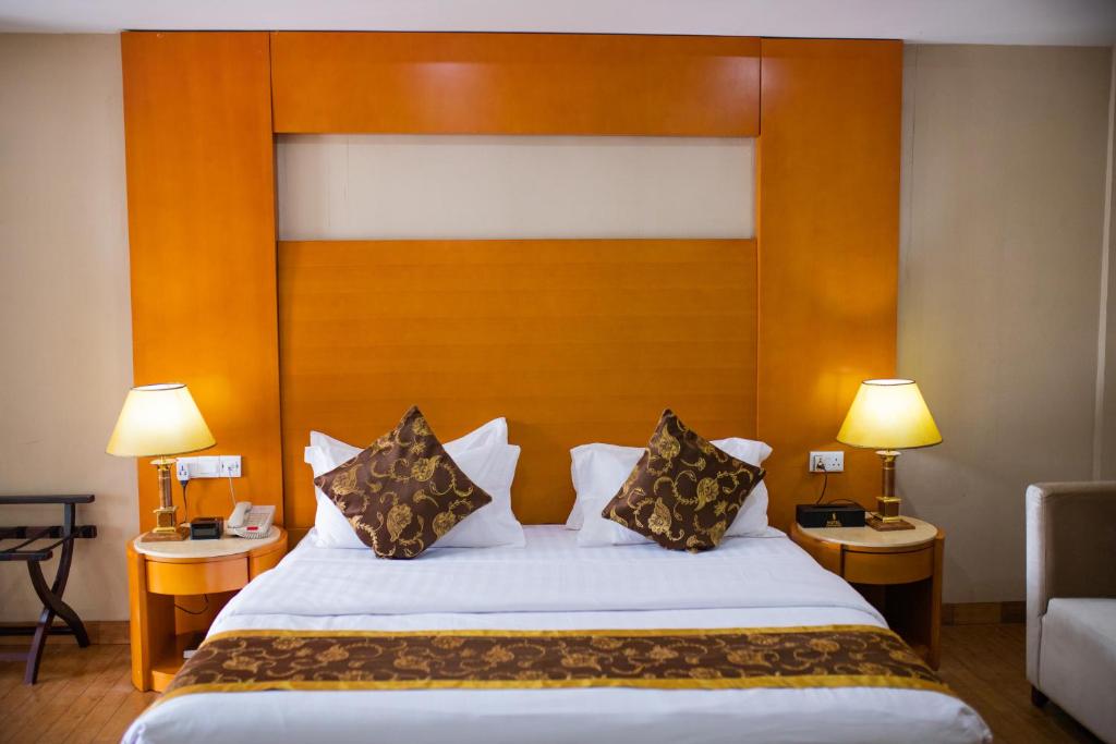 Postel nebo postele na pokoji v ubytování Hotel Sunshine Enugu