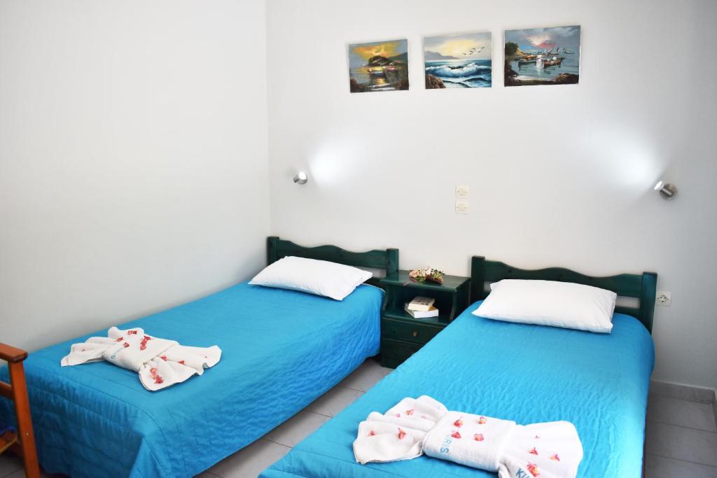 Postel nebo postele na pokoji v ubytování Kuris Studios & Apartments