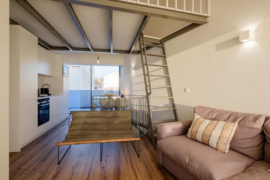 a living room with a couch and a loft at BOUTIQUE Rentals- ATTICO Luxury Design-Ocean views in Porto