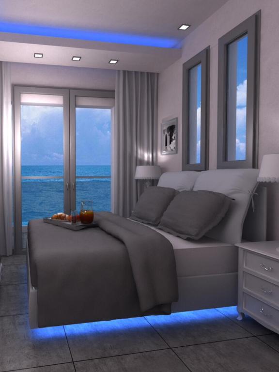 Postel nebo postele na pokoji v ubytování Kymata Hotel