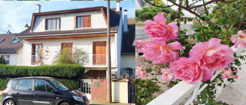 une voiture garée devant une maison avec des fleurs roses dans l'établissement Super Appart ds pavillon, équipé, calme (Ref: KA0), à Montfermeil
