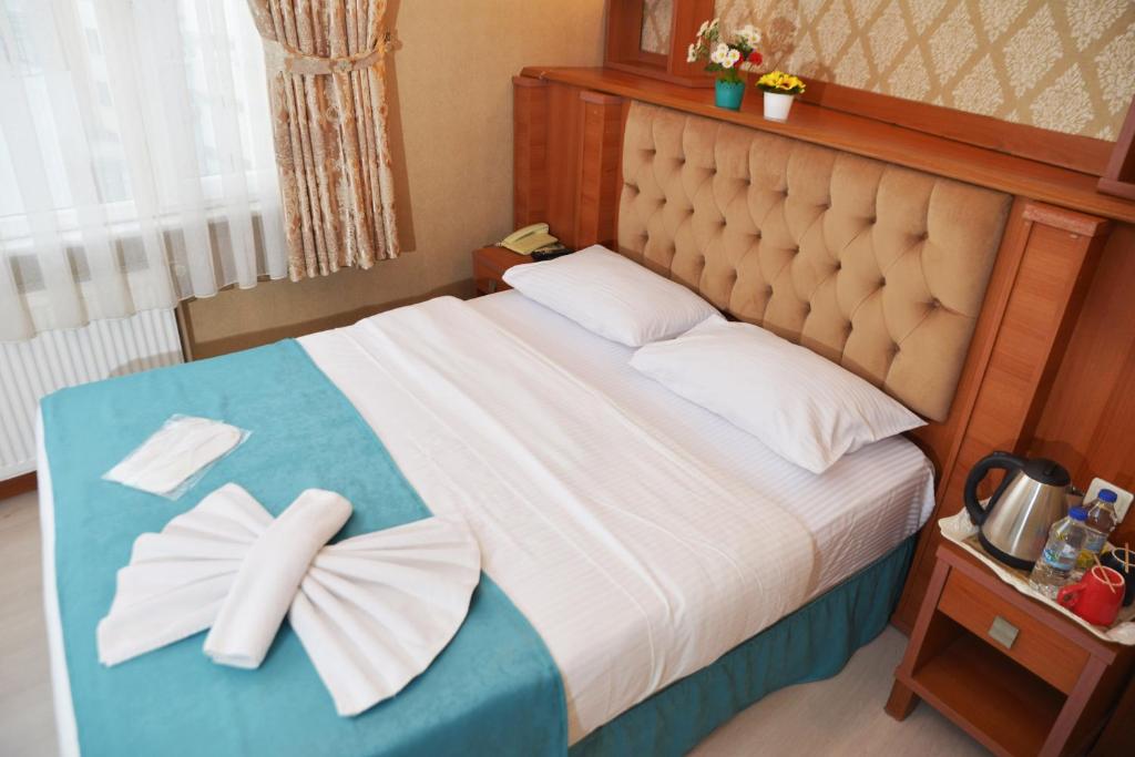 Postel nebo postele na pokoji v ubytování Old City Viva Hotel