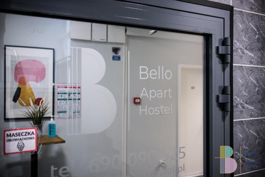 a glass door with the number on it at Bello ApartHostel in Warsaw